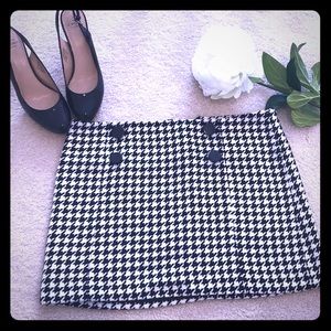 Black and white wool herringbone mini skirt.